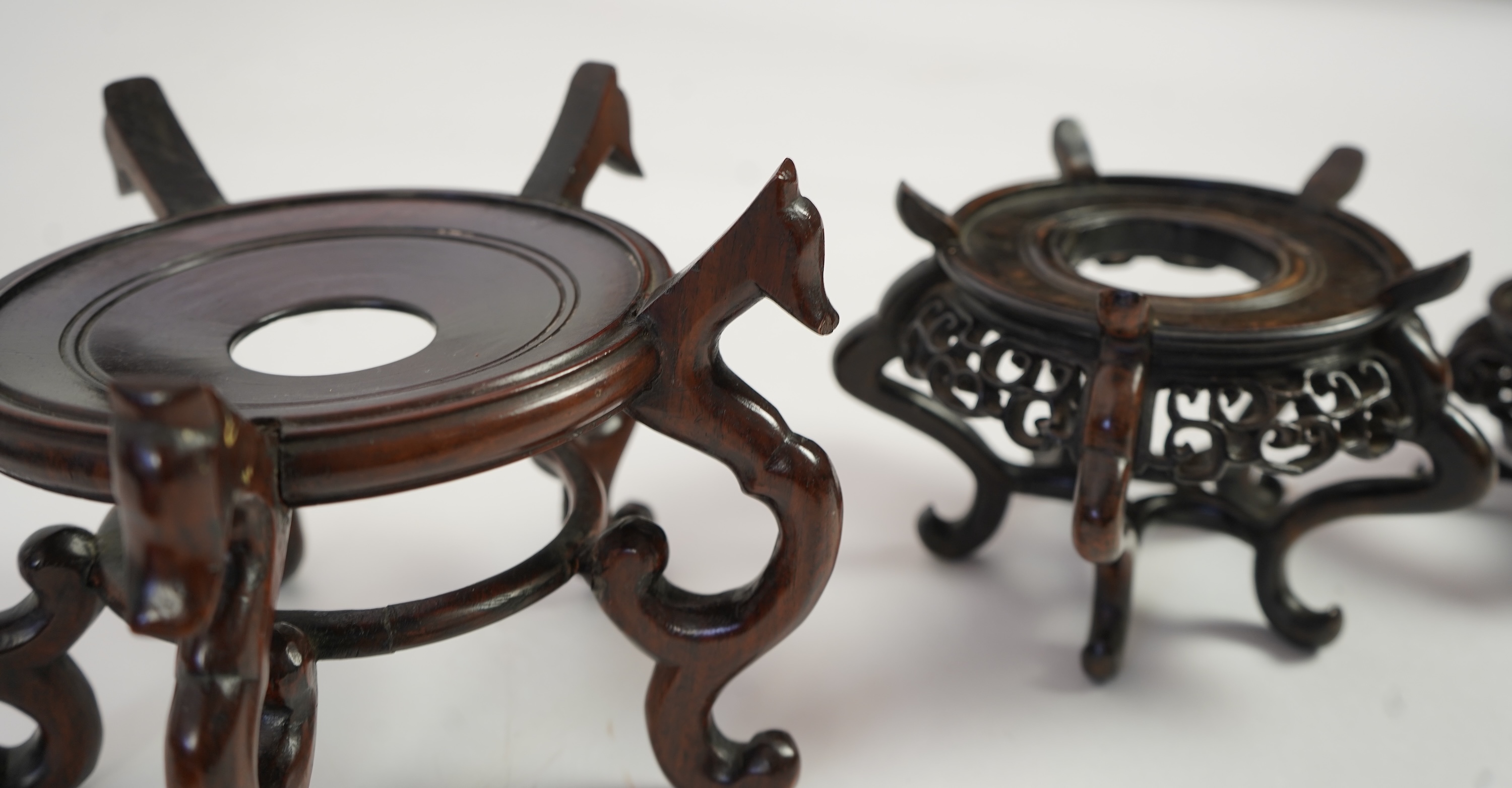 A group of sixteen Chinese hardwood stands together with a Japanese stand, 19th/20th century